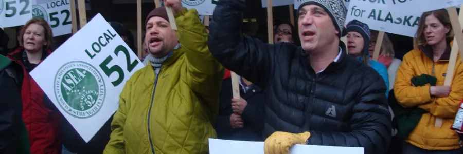 Workers rallying with signs that say Alaskans working for Alaska